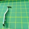 Guarda Looper para Fileteadora KG59QX, repuesto de alta calidad para protección y seguridad en máquinas de coser industriales y domésticas.