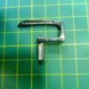 Imagen del Looper Collarin Kansay Special - 19-539, pieza robusta que fija y alinea partes en máquinas industriales para asegurar una producción estable y de alta calidad.