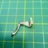Looper Superior para Fileteadora Baby Lock 711A, repuesto de alta precisión para garantizar costuras firmes y uniformes en máquinas de coser.