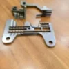 Planchuela y dientes de ajuste E217-D208D-H208 para máquina de coser, diseñados para mejorar la precisión, durabilidad y estabilidad en la producción textil.